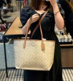 COACH CITY SIGNATURE